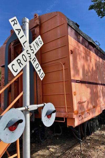 A trainer and railroad crossing sign at the Sioux City Railroad Museum